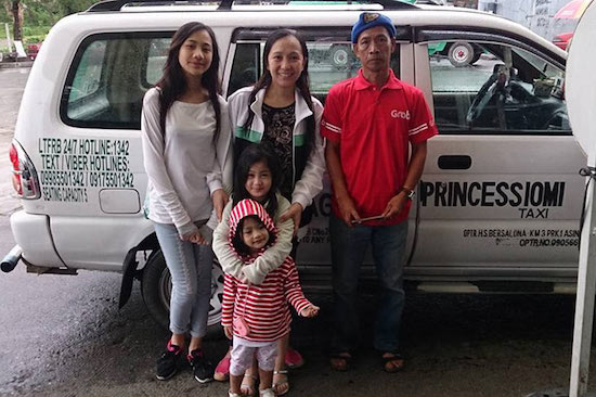Raymundo Bersalona with some of his passengers