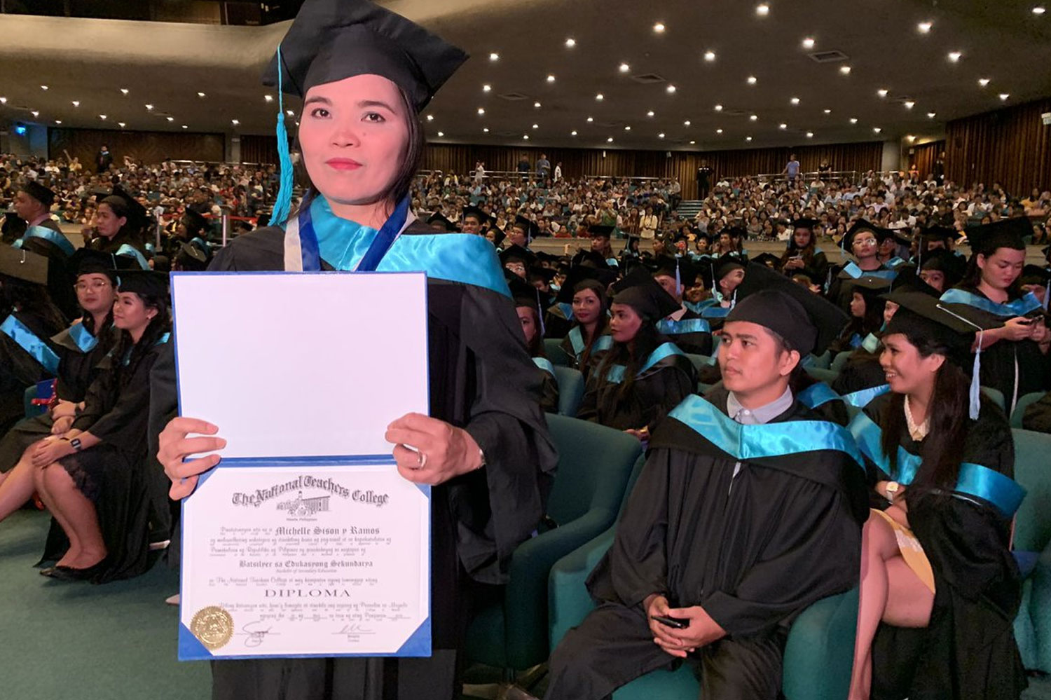 Single mother Michele Sison Cum laude graduate